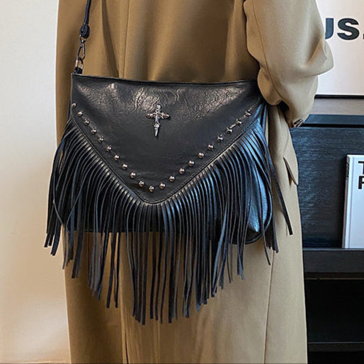 The Rivet Rebel - Trendy Crossbody Bag with Tassel Accent