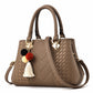 Chic and Versatile Woven Handbag with Tassel Charm