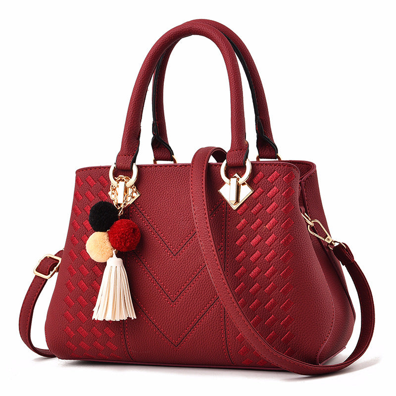 Chic and Versatile Woven Handbag with Tassel Charm