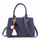 Chic and Versatile Woven Handbag with Tassel Charm