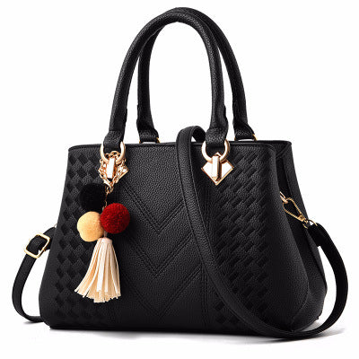 Chic and Versatile Woven Handbag with Tassel Charm