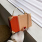 The Serpentine Clutch: RAMODO Evening Bag - Orange