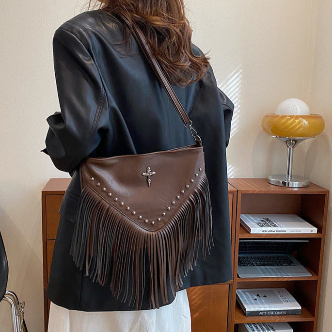 The Rivet Rebel - Trendy Crossbody Bag with Tassel Accent