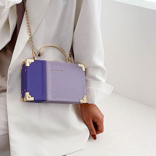 The Serpentine Clutch: RAMODO Evening Bag - Purple