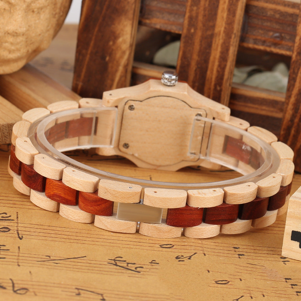 Wooden watch with a unique band design on a sheet of music