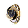 Gold and black watch with decorative band on a white background