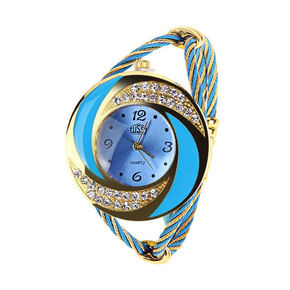 Wristwatch with blue and gold design on a white background