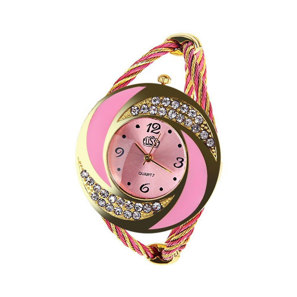 Wristwatch with pink and gold design on a white background