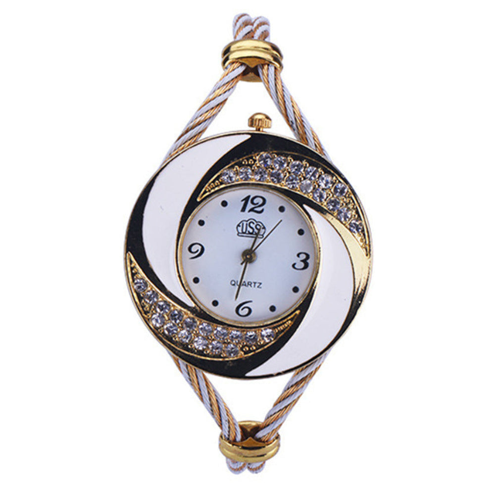 Decorative watch with intricate design on a white background