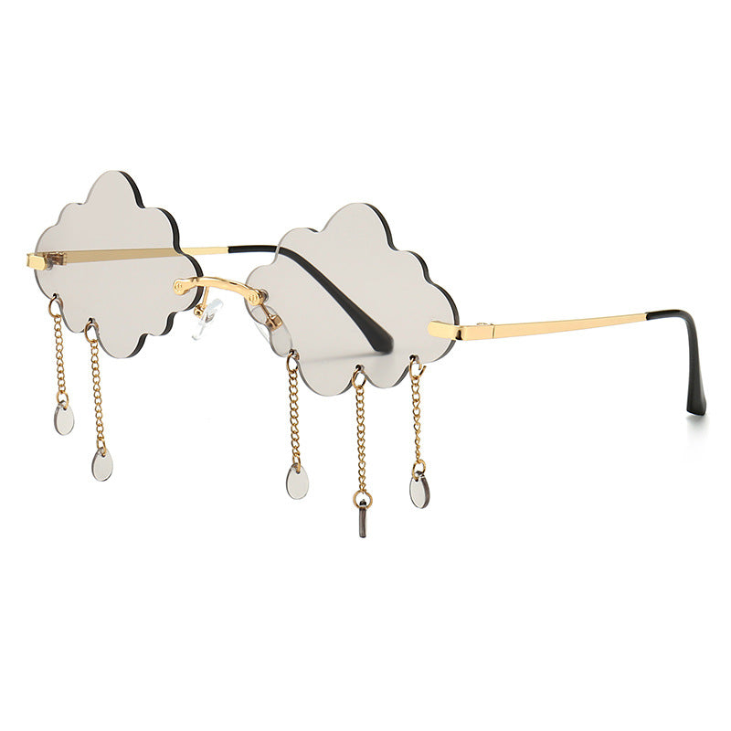 Sunglasses with cloud design and chain details on a white background