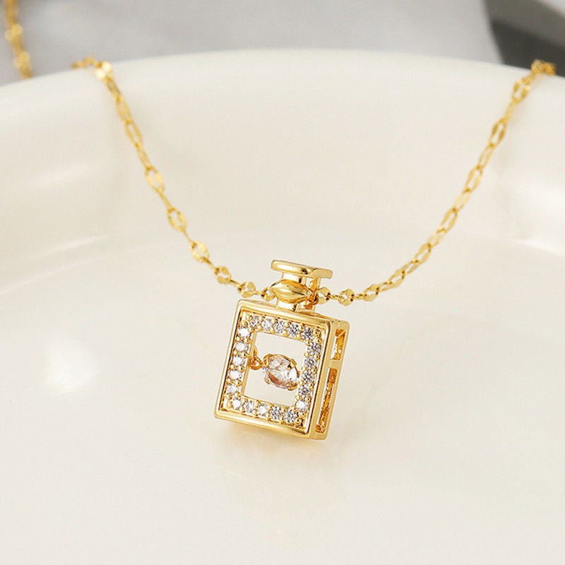 Gold necklace with a square pendant on a white background