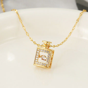 Gold necklace with a square pendant on a white background