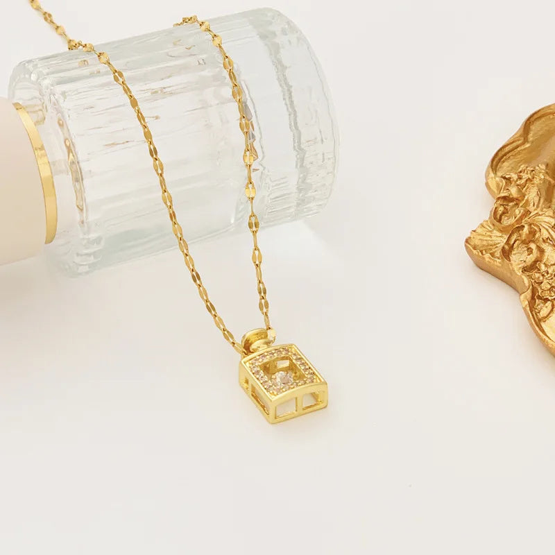 Gold necklace with a pendant on a white background