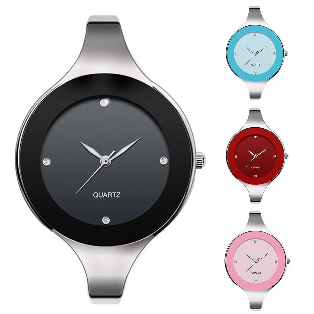 Set of four watches with different colored faces on a white background