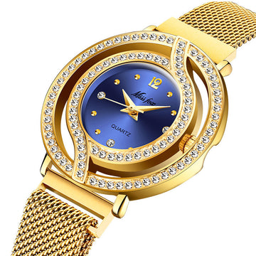 Gold wristwatch with a blue face and diamond-like accents on a white background