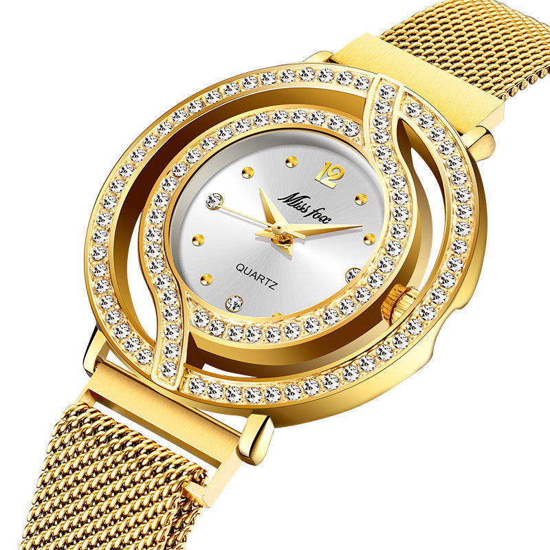Gold watch with diamond-studded face on a white background