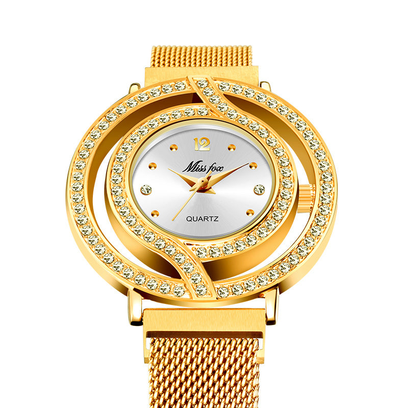 Gold wristwatch with diamond-studded bezel on a white background