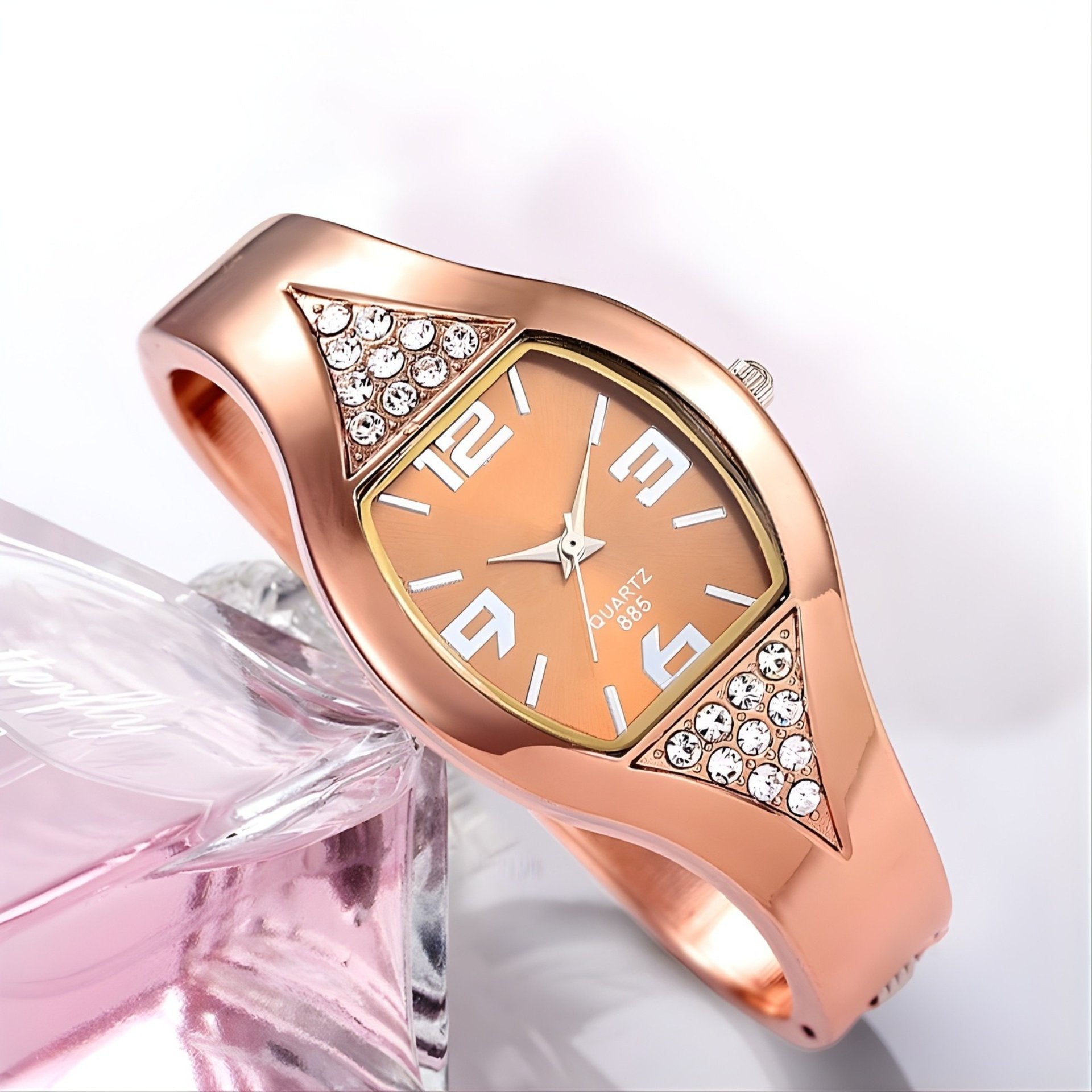 Rose gold watch with diamond accents on a white background