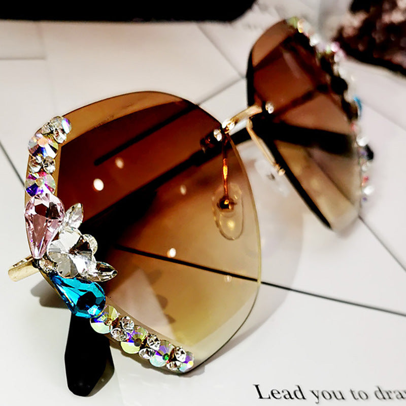 High-fashion Celestial Glow rimless diamond butterfly sunglasses in brown color with crystal-embellished lenses.