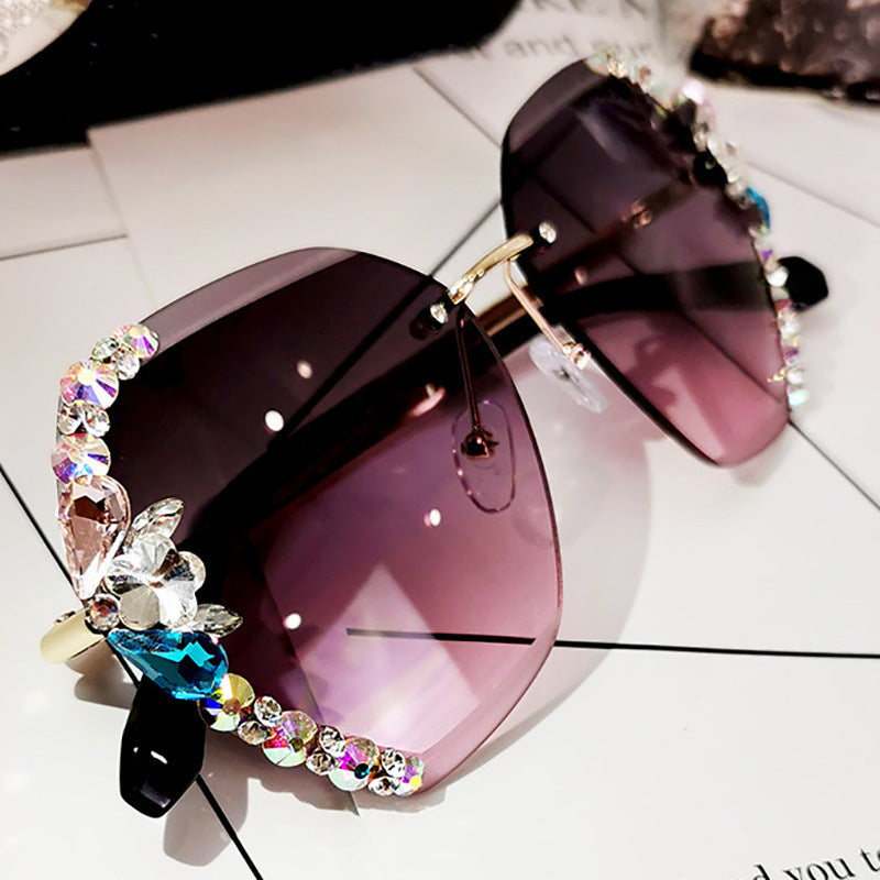 High-fashion Celestial Glow rimless diamond butterfly sunglasses in purple  color with crystal-embellished lenses.