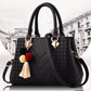 Chic and Versatile Woven Handbag with Tassel Charm