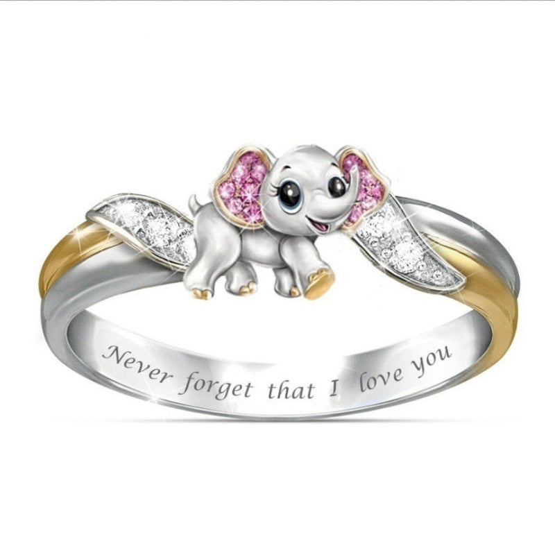 Ring with a small elephant design and pink gemstones on a white background