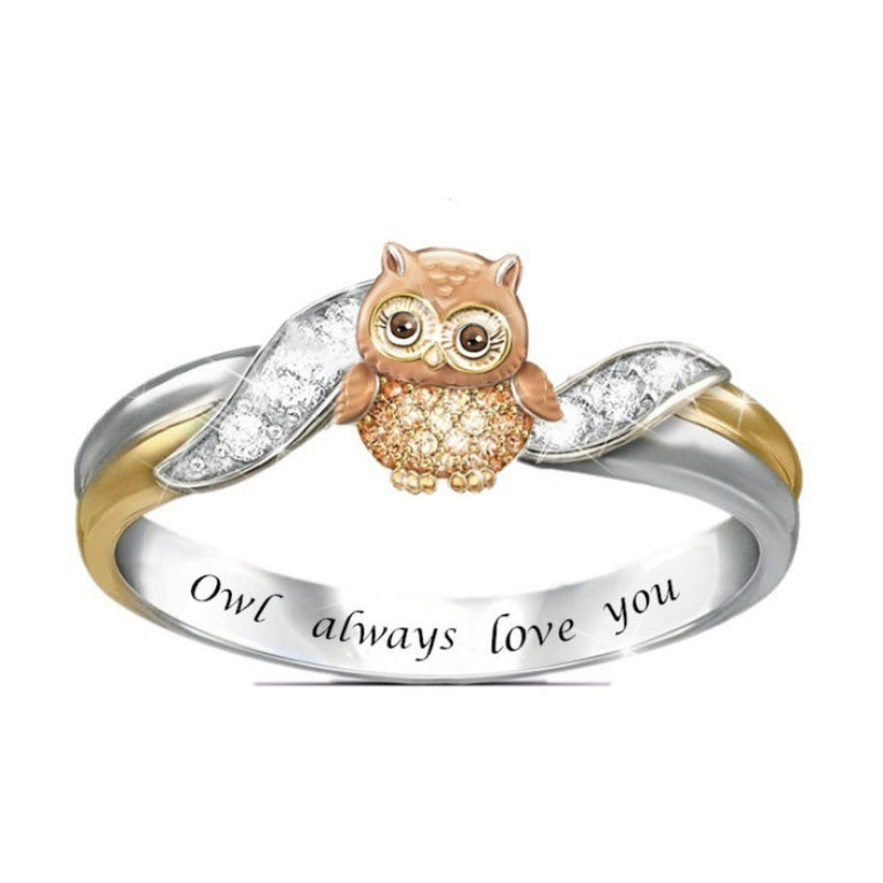 Ring with owl design and 'Owl always love you' engraving on a white background