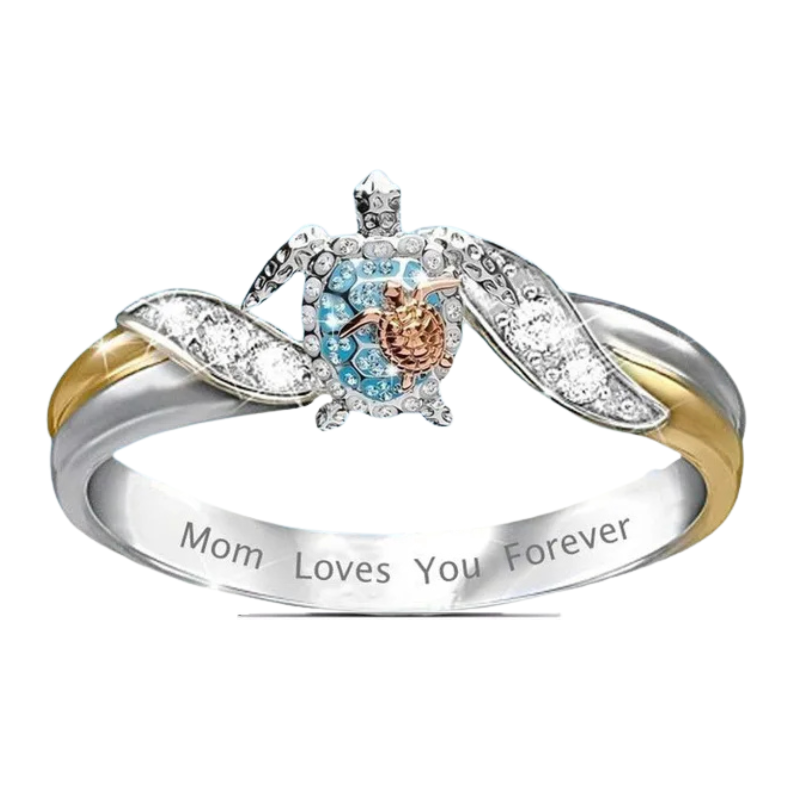 Silver ring with turtle design and 'Mom Loves You Forever' engraving on a white background
