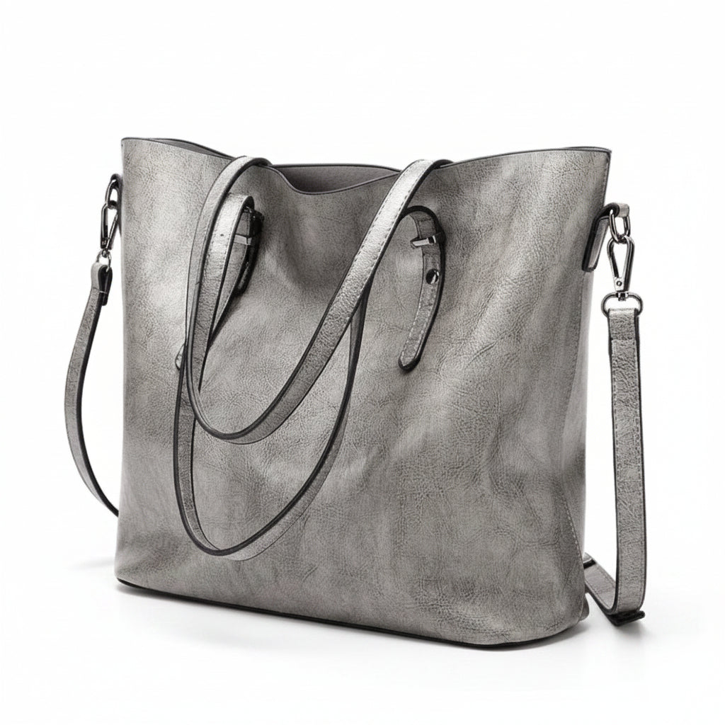 Gray tote bag with shoulder strap on a beige background