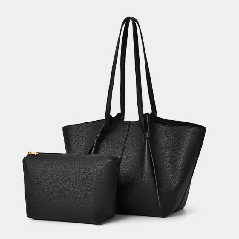 A black pebbled PU-leather tote bag with two shoulder straps, shown with a matching zippered pouch in front on a light gray background. Text at the bottom reads 'One package for two purposes'.