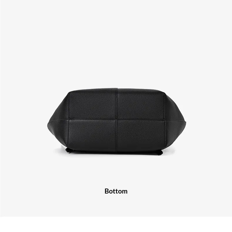 Black quilted leather bottom view of a handbag on a light gray background with the word 'Bottom' printed below.